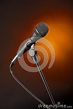 Microphone on Spotlight Gold Backgorund