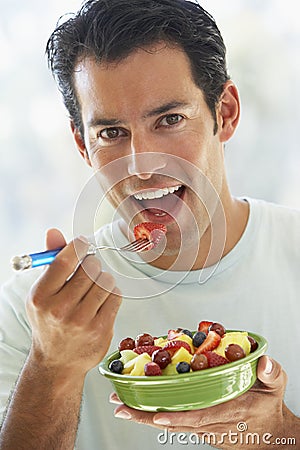 [Image: mid-adult-man-eating-fresh-fruit-salad-7870748.jpg]