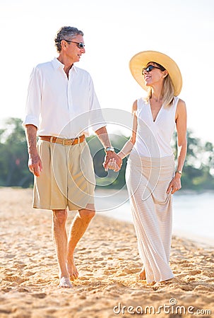 Middle Aged Couple Enjoying Walk on the Beach