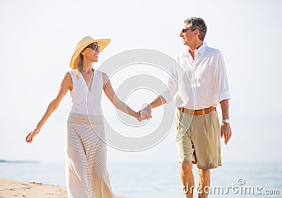 Middle Aged Couple Enjoying Walk on the Beach