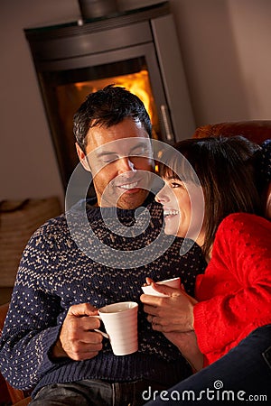 Middle Aged Couple Sitting With Hot Dri