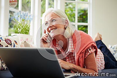 Middle Aged Woman Ordering Item On Telephone