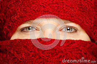 Middle-aged woman wrapped up in red scarf