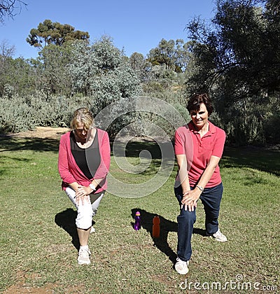 Middle-aged Women Stretching Legs Before Exercise.