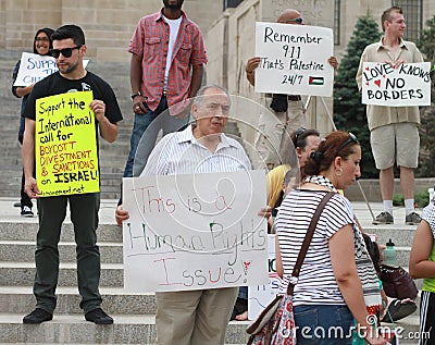 Middle East Crisis prompts protestors with signs a