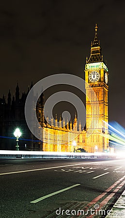 Midnight in London with Big Ben and passing traffi
