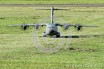 Military cargo airplane(A-400M)-landing on grass runway