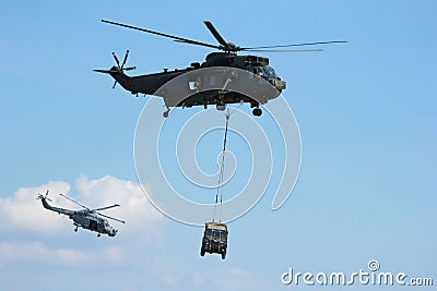 Military Helicopter carrying jeep