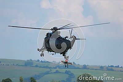 Military Helicopter rescuing injured soldier