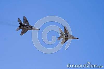 Military jets flying through the sky