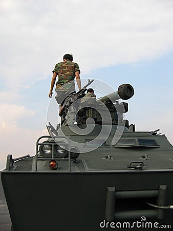 Military - soldiers on tank with machine gun