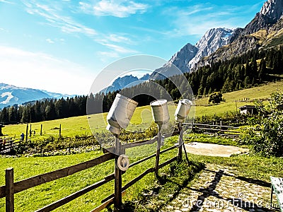 Milk cans on a mountain pasture