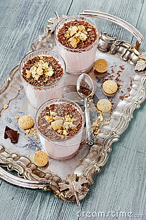 Milkshake with chocolate and cookies on a vintage tray