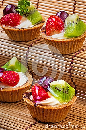 Mini fruit tart and wooden background