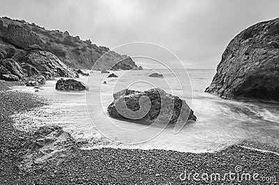 Minimalist seascape. Long exposure of sea and rocks.