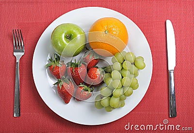 Mix fruits on plate healthy nutrition concept