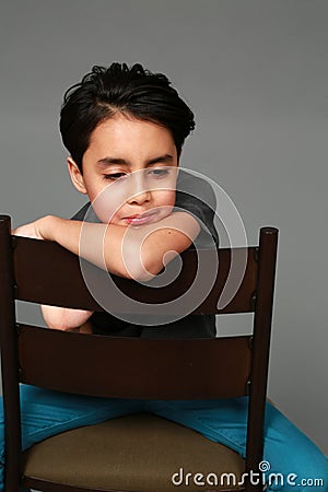 Mixed race boy looking down