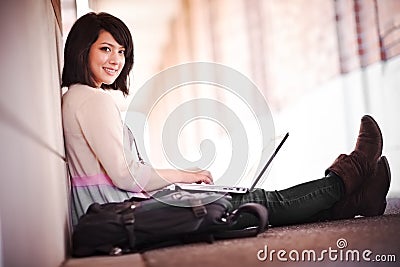 Mixed race college student with laptop