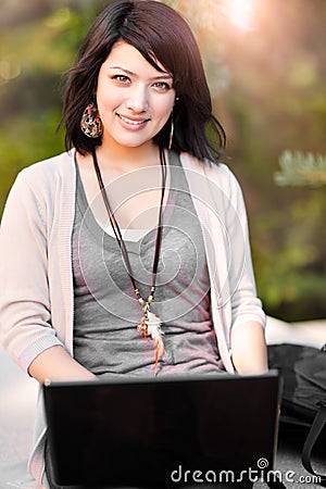 Mixed race college student with laptop