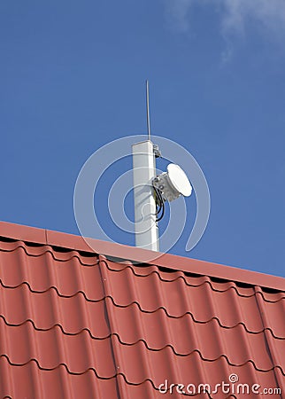 Mobile network antenna on the roof with small dish