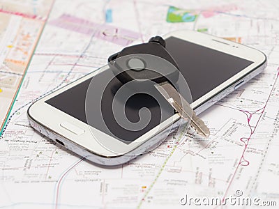 Mobile phone and key car on the map.