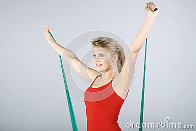Model in gymnastics with stretch band
