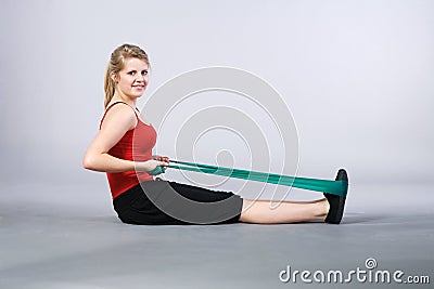 Model in gymnastics with stretch band