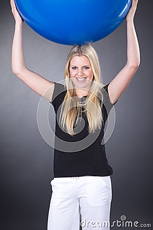 Model makes sport with gym ball