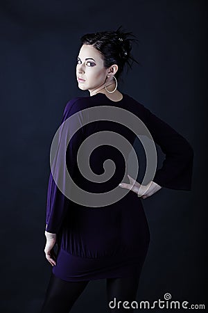 Model in purple mini dress