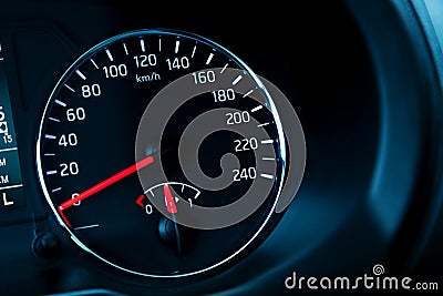 Modern automotive speedometer on black