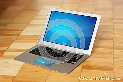 Modern conceptual laptop computer on wooden floor