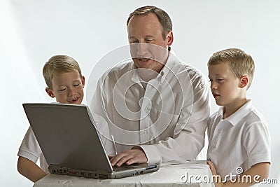 Modern Dad teaching his 6 years old boys