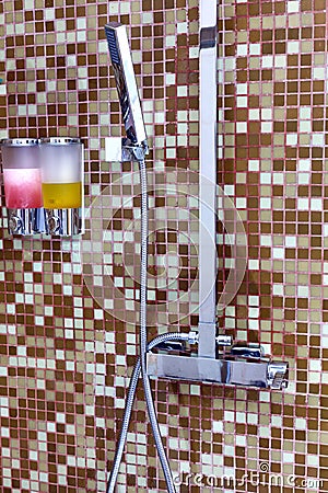 Modern designer tap and shower in bathroom