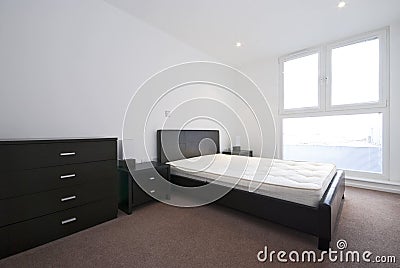 Modern double bedroom with large double bed