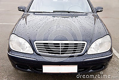 Modern expensive car with drops on a hood