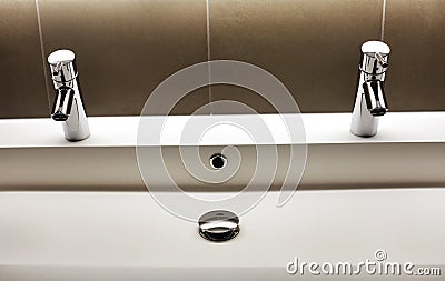 Modern kerrock sink with two shining tap faucets