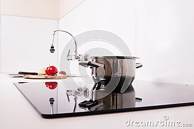 Modern kitchen; cook the induction cooker.