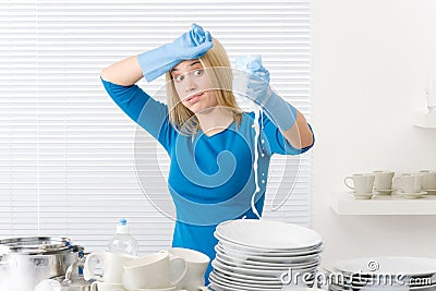 Modern kitchen - frustrated woman washing dishes