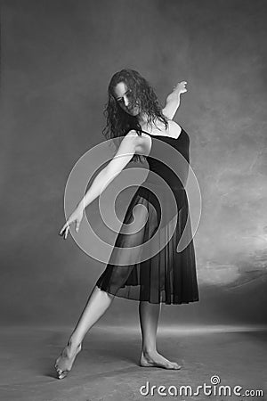 Modern style dancer posing on grey background