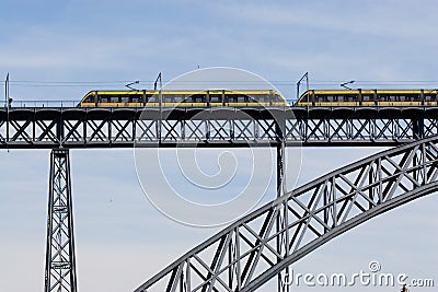 Modern train crossing a modern bridge
