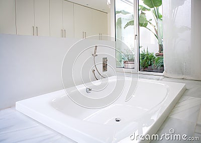 Modern white house bathroom bathtub with courtyard skylight