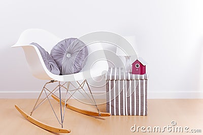 Modern white rocking chair and wall