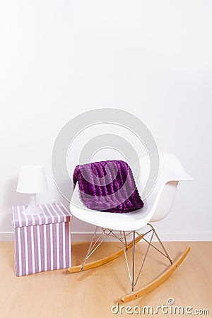 Modern white rocking chair and wall