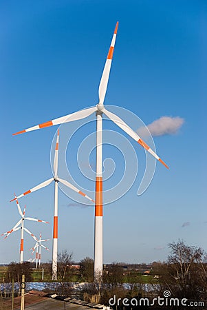 Modern windmills against the blue sky.