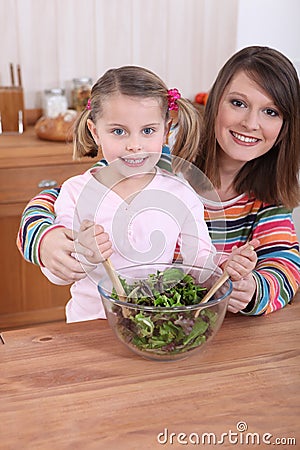 Mom and daughter cooking