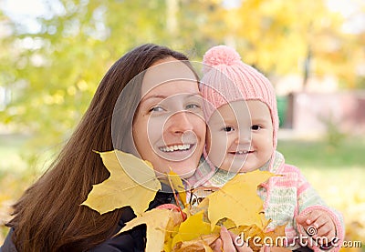 Mom and daughter with leaves