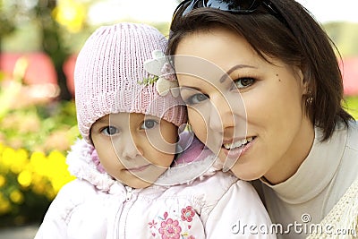 Mom and girl in the autumn