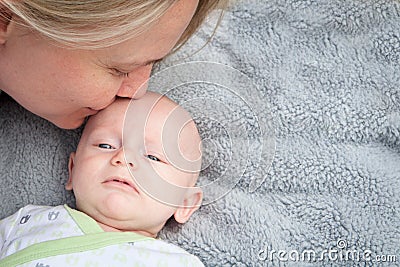 Mom Kissing Baby