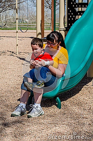 Mom and son at bottom of slide