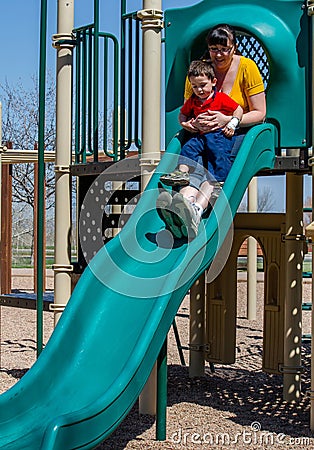 Mom and son play at playground